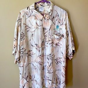 Men’s Hawaiian shirt in XL size by Cintas.